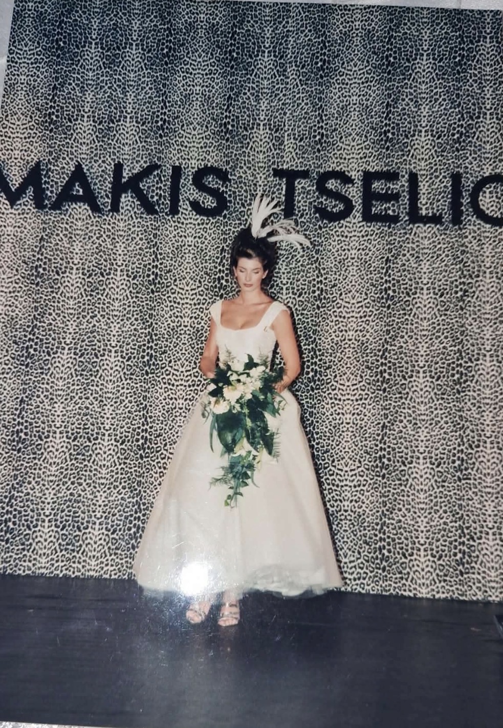 Makis Tselios bridal fashion presentation with floral bouquet