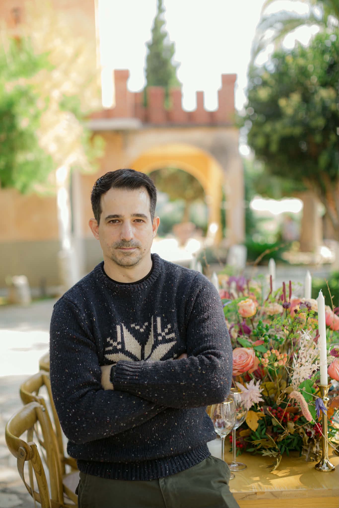 Giannis Konstantakopoulos standing outdoors at a garden venue
