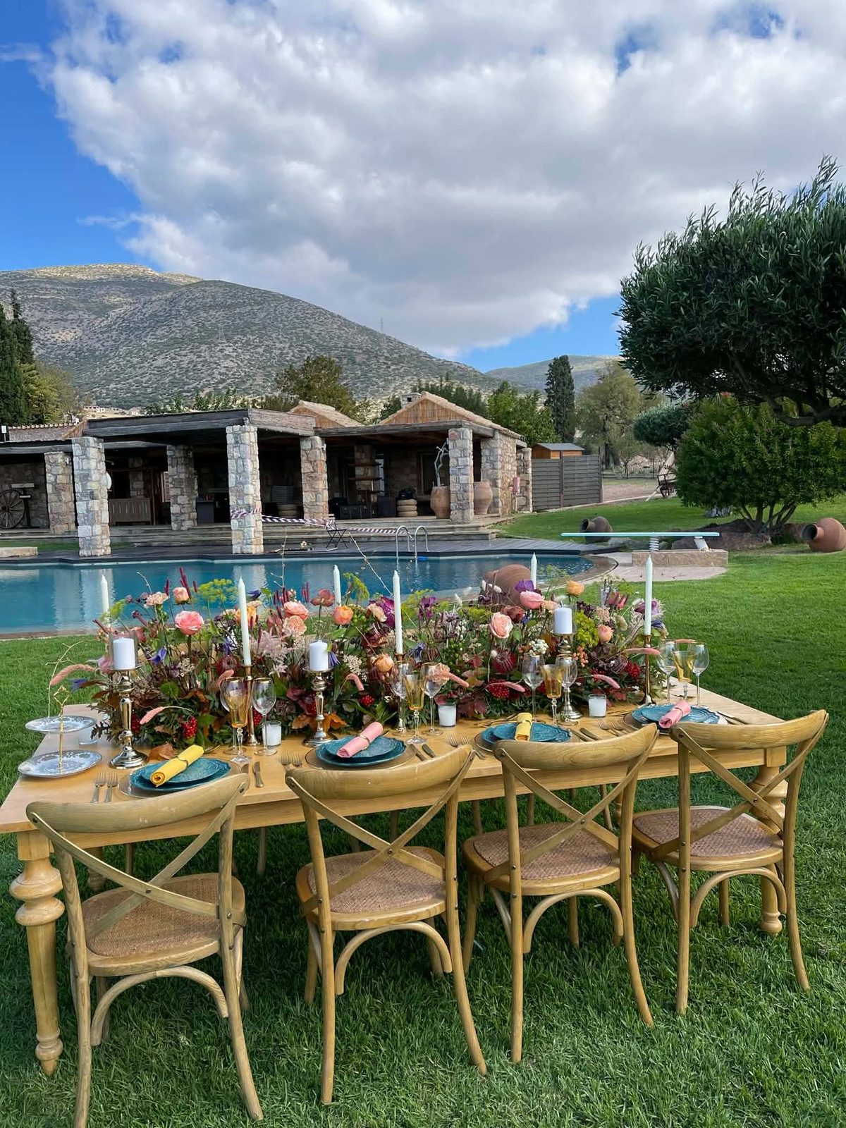 Poolside villa table decorated with white floral arrangements