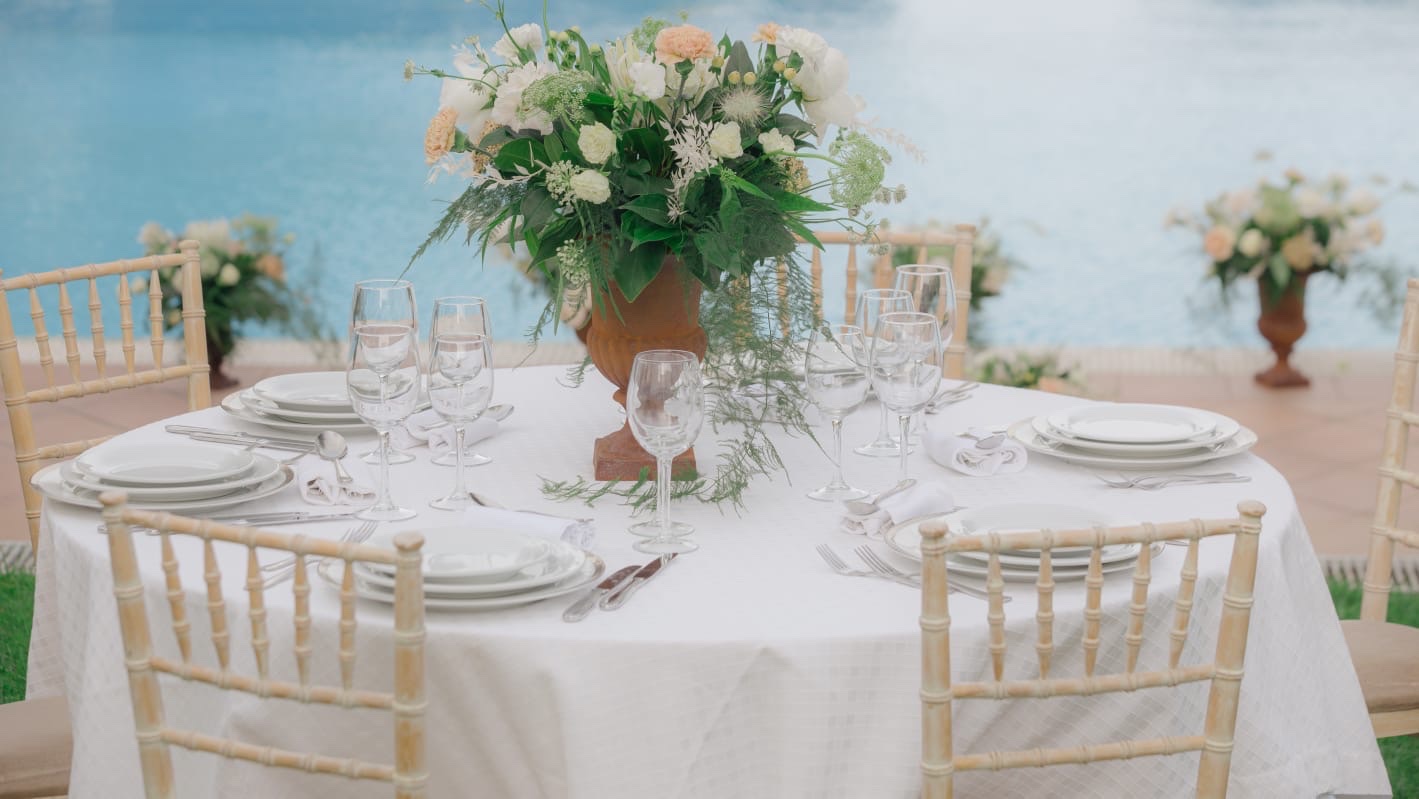 Waterside floral table setting in Greece